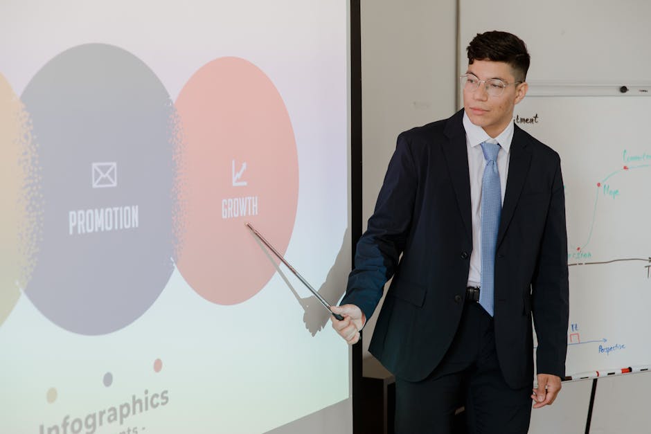 Man in suit presenting growth and promotion strategies during a meeting.